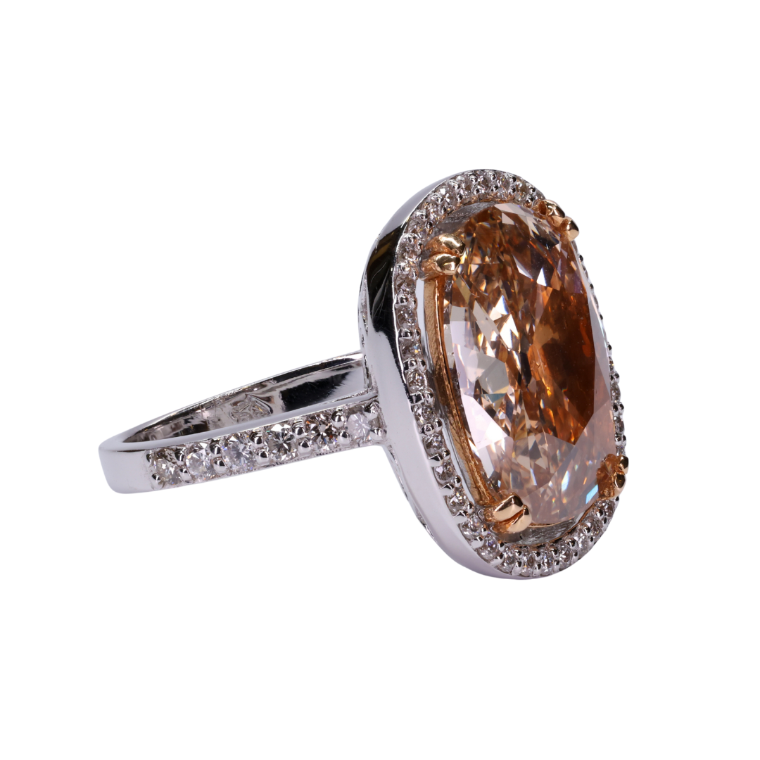 Old cut oval shaped orange brownish fancy intense diamond with Halo of Diamonds Ring