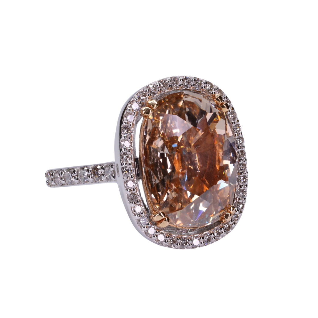 Old cut oval shaped orange brownish fancy intense diamond with Halo of Diamonds Ring