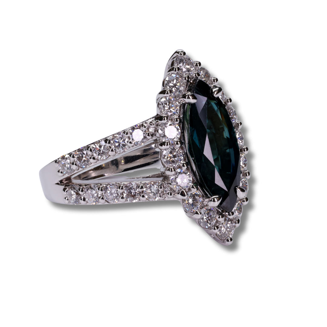 Imperial Marquise Sapphire Ring with a halo of Diamonds in 18K White Gold